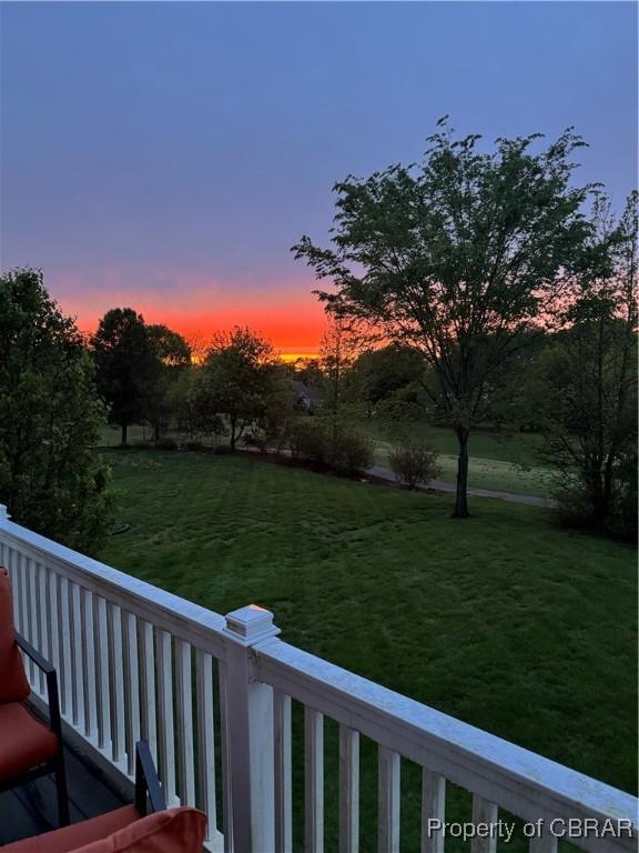 view of yard at dusk