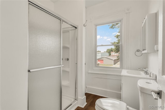 207 E Virginia Ave, Crewe, VA 23930 - bathroom with a shower stall, wood finished floors, and vanity
