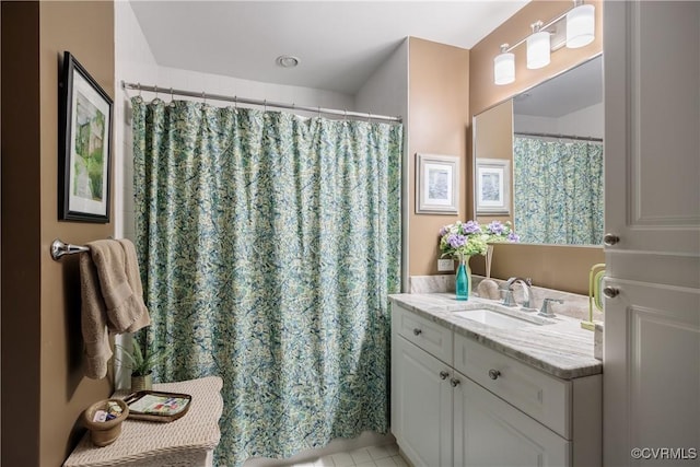 bathroom featuring tile patterned flooring and vanity