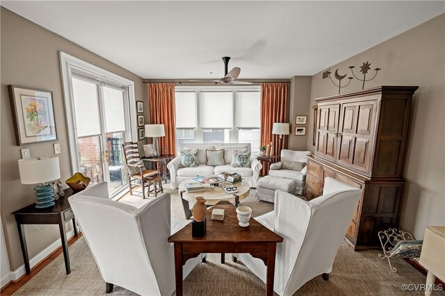 living room with ceiling fan and a healthy amount of sunlight