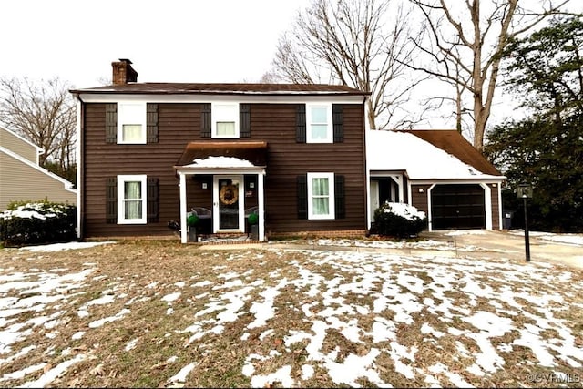 colonial inspired home with a garage