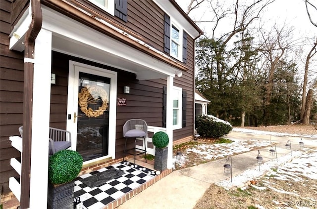 entrance to property featuring covered porch