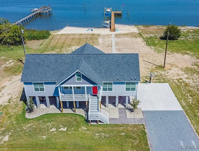 birds eye view of property with a water view