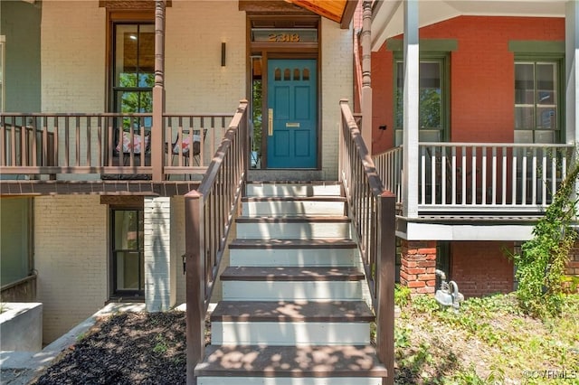 entrance to property featuring a balcony