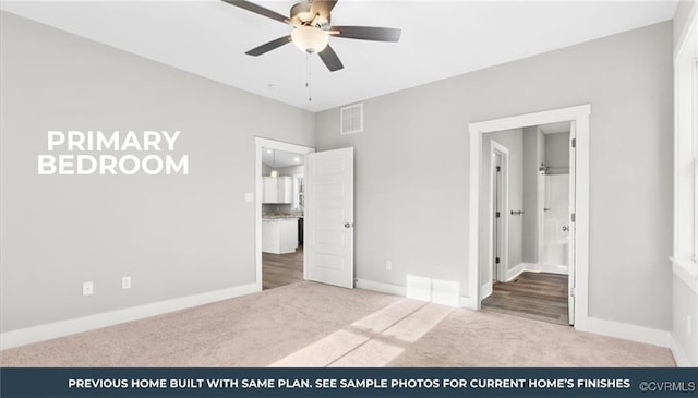 unfurnished bedroom with connected bathroom, ceiling fan, and light colored carpet