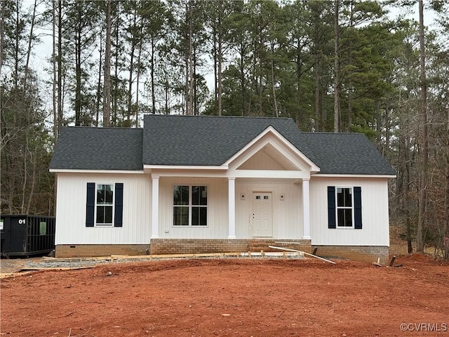 view of front of house featuring a porch and cooling unit