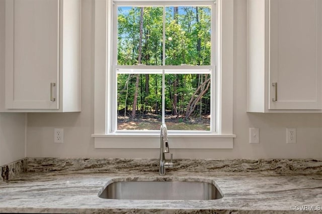548 Anchor Dr, Bracey, VA 23919 - kitchen view of white cabinetry and light stone counters