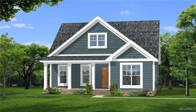 view of front facade with a shingled roof and a front yard