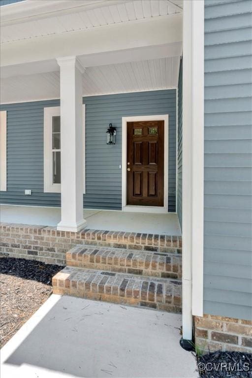 73 Jamestown Ln, Bracey, VA 23919 - property entrance featuring a porch