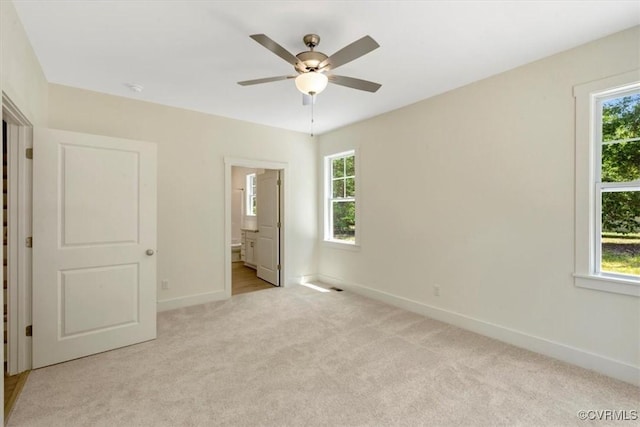 73 Jamestown Ln, Bracey, VA 23919 - unfurnished bedroom featuring carpet floors, ensuite bathroom, and ceiling fan