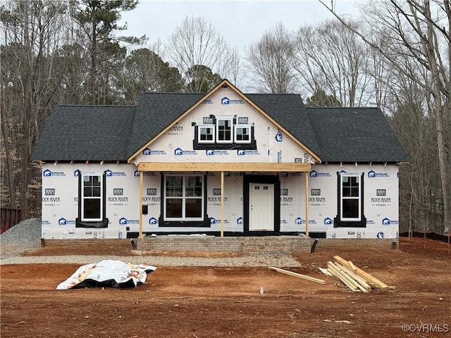 property under construction featuring a shingled roof