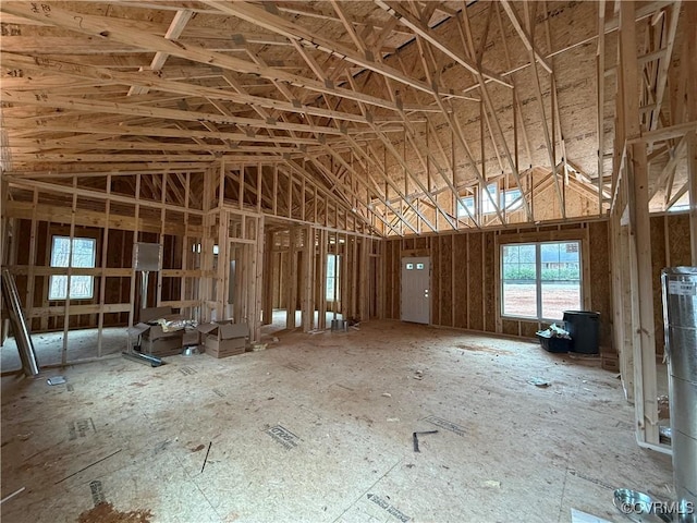 miscellaneous room with high vaulted ceiling