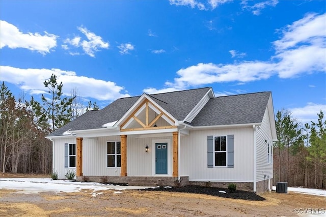 view of front of house with covered porch and central air condition unit