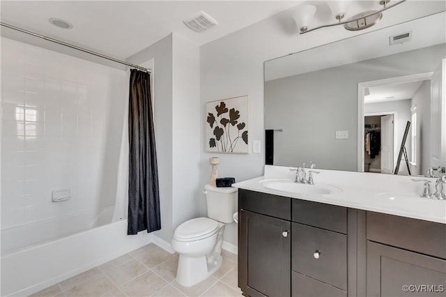 full bathroom featuring toilet, vanity, tile patterned flooring, and shower / tub combo with curtain