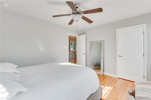 bedroom featuring ceiling fan and light hardwood / wood-style flooring