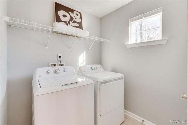 laundry room featuring washing machine and clothes dryer