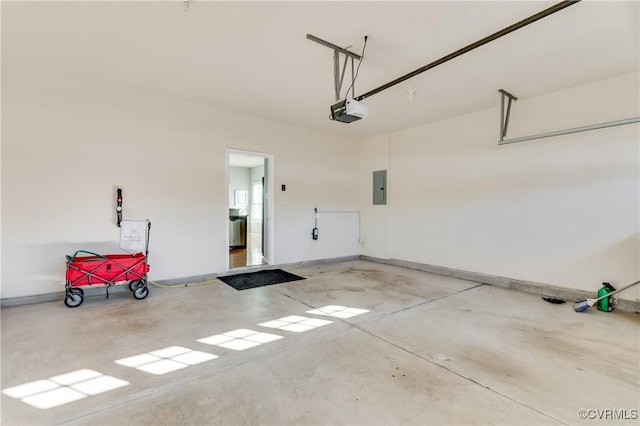 garage featuring electric panel and a garage door opener