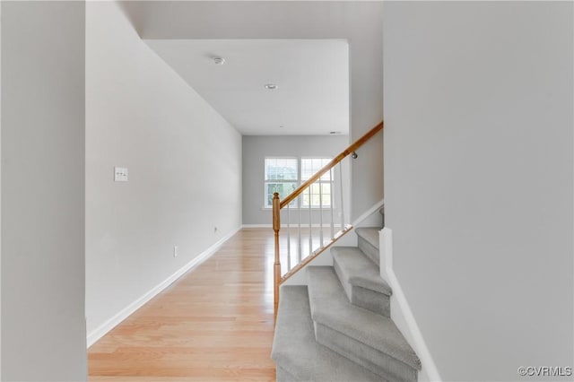 staircase featuring hardwood / wood-style flooring