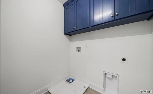 laundry area featuring hookup for an electric dryer, washer hookup, and cabinets