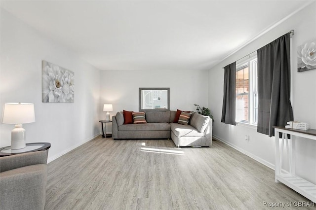 living room with wood finished floors and baseboards