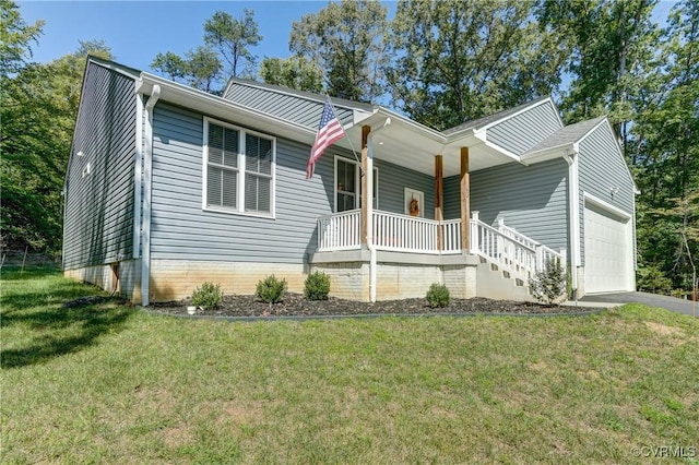 view of front of property featuring covered porch, a front yard, and a garage