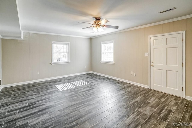 unfurnished room featuring ceiling fan and ornamental molding