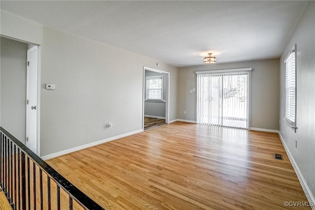 spare room with hardwood / wood-style flooring