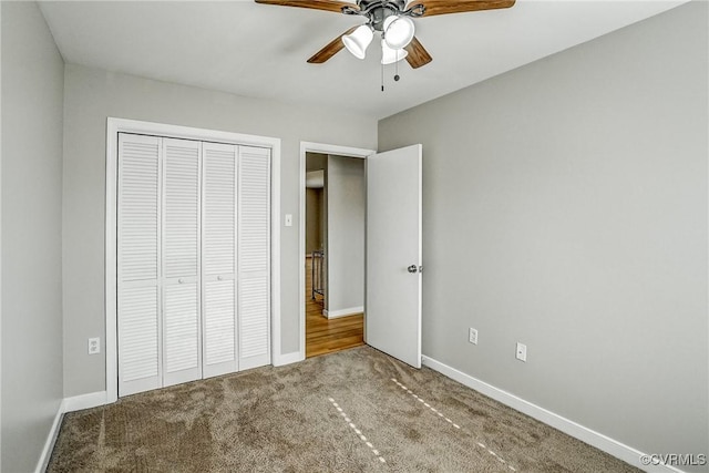 unfurnished bedroom featuring carpet floors, a closet, and ceiling fan