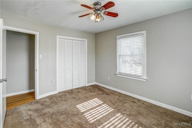 unfurnished bedroom featuring ceiling fan, a closet, and carpet floors