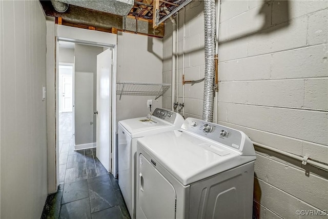 clothes washing area with independent washer and dryer