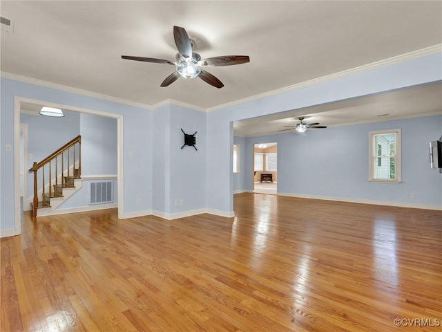 unfurnished living room with ceiling fan, light hardwood / wood-style floors, and ornamental molding