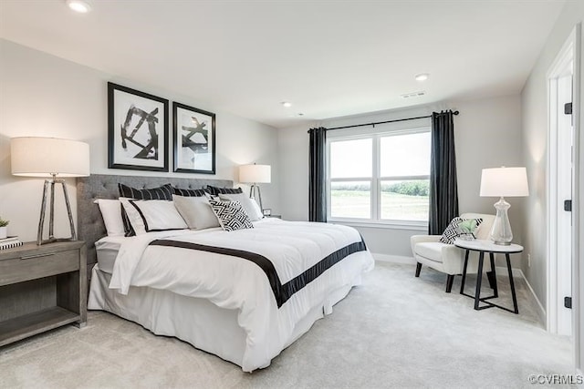 bedroom featuring light colored carpet