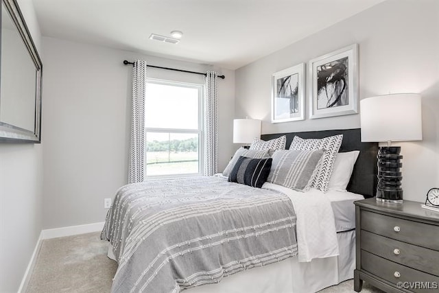 bedroom featuring light colored carpet