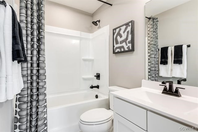 full bathroom with vanity, shower / tub combo, and toilet