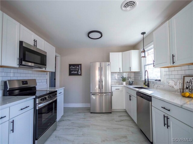 kitchen featuring sink, white cabinets, and stainless steel appliances