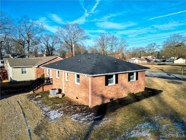 view of side of property with central AC