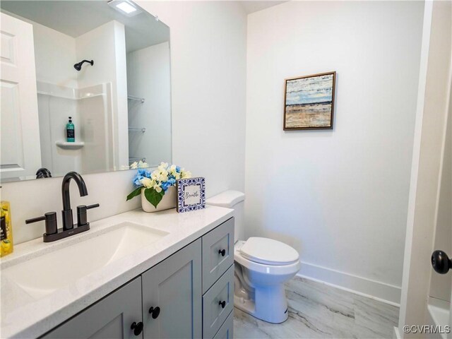 bathroom with toilet and vanity