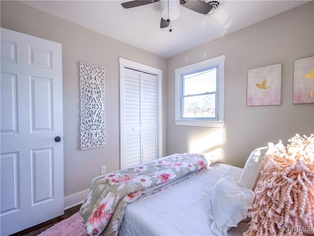 bedroom with ceiling fan and a closet