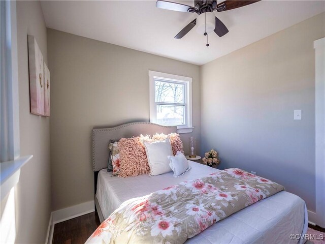 bedroom with ceiling fan and hardwood / wood-style floors