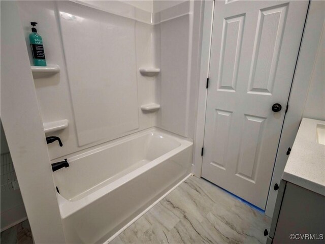 bathroom with bathtub / shower combination and vanity