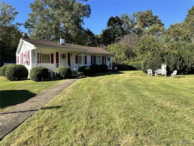 ranch-style house featuring a porch and a front lawn