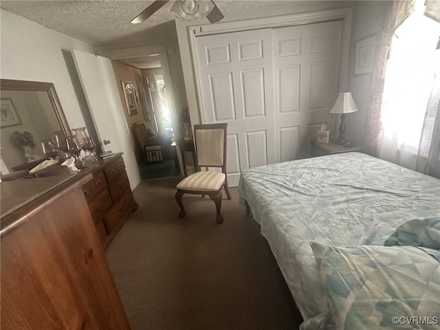 bedroom featuring a textured ceiling, a closet, ceiling fan, and carpet floors