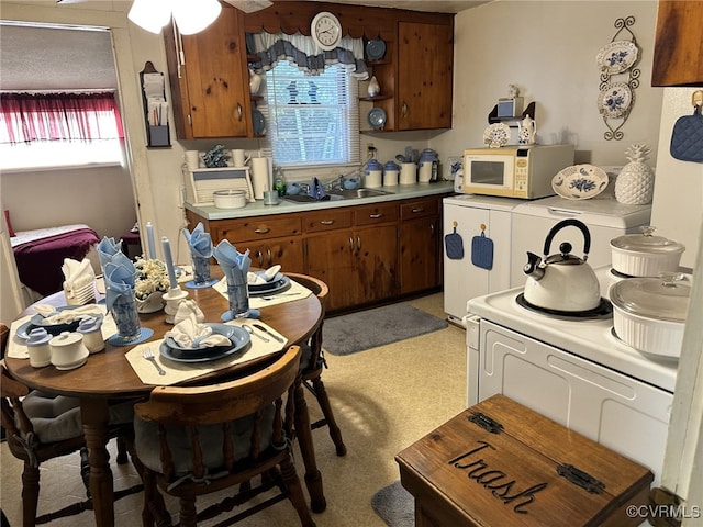 kitchen with washer / dryer and sink