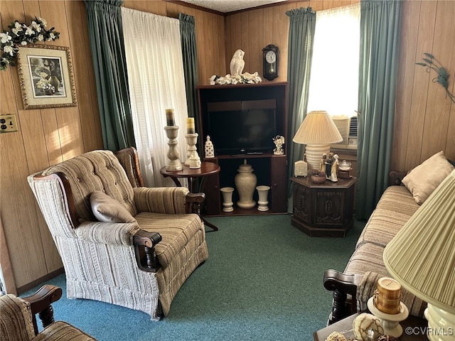 living area featuring carpet, wood walls, and crown molding