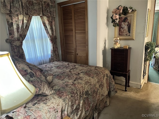 carpeted bedroom with a closet