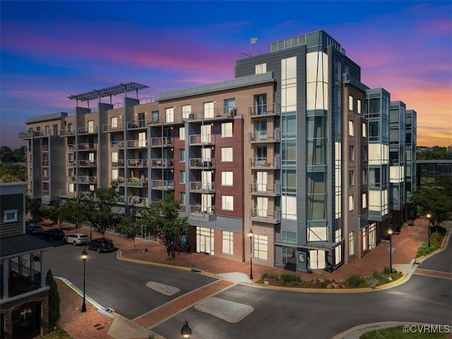 view of outdoor building at dusk