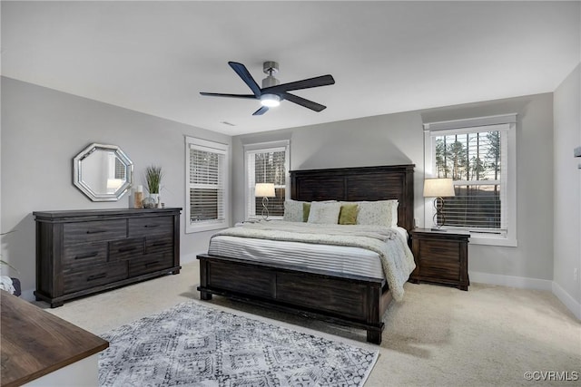 bedroom featuring ceiling fan and light carpet