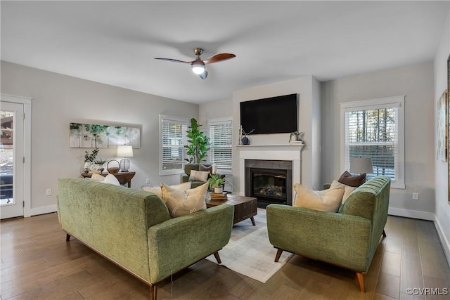 living room with hardwood / wood-style floors and ceiling fan