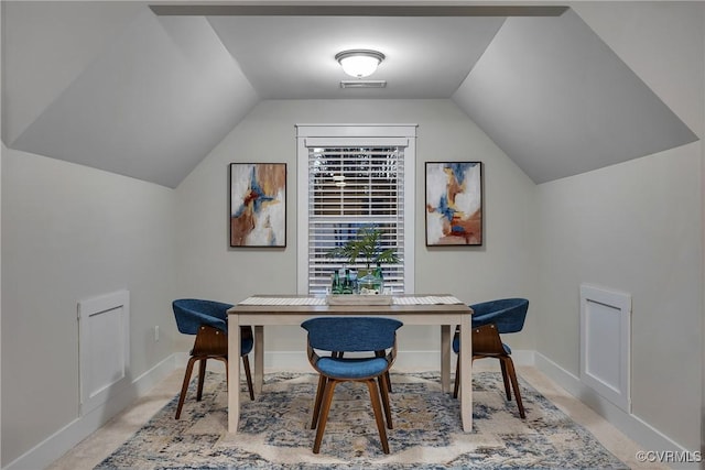 carpeted office space with lofted ceiling