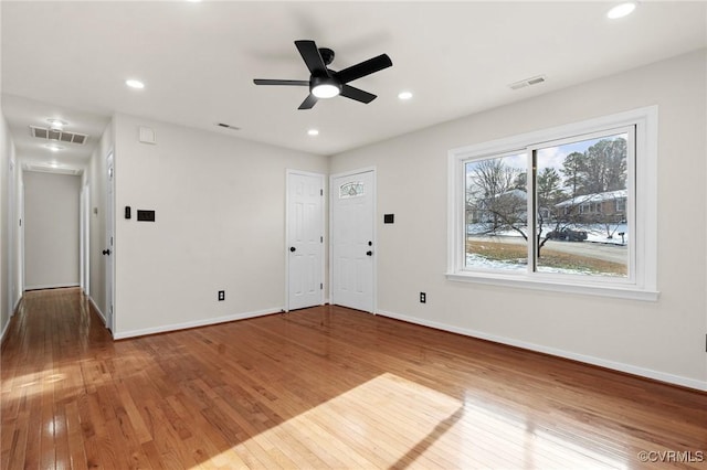 empty room featuring ceiling fan and wood-type flooring